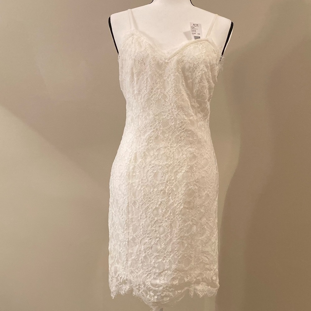White Lace covered dress. Mid-Thigh length. Size L